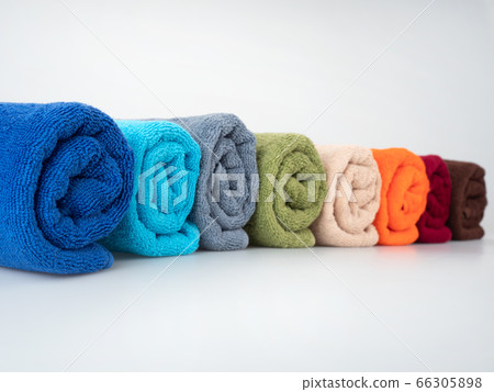 multicolored towels on a white background multicolored towels on a white background 66305898