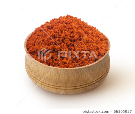 Red paprika powder in wooden bowl isolated on white background Red paprika powder in wooden bowl isolated on white background 66305937