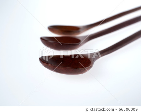 wooden spoons on a white background wooden spoons on a white background 66306009