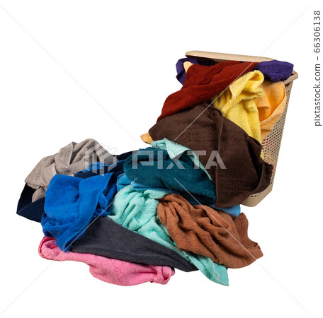 Laundry basket with a pile of towels isolated on 66306138