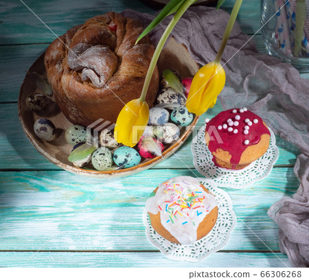 Easter composition with colorful eggs and cakes Easter composition with colorful eggs and cakes 66306268