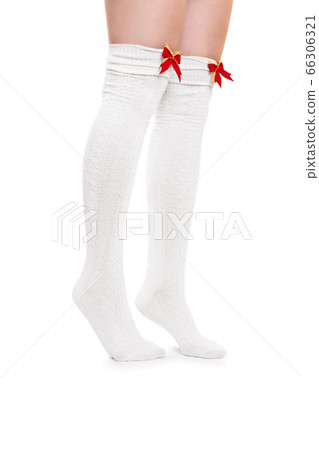 Female legs in white stockings tiptoeing Female legs in white stockings tiptoeing 66306321