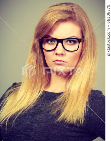 Closeup of woman thinking face expression Closeup of woman thinking face expression 66306879