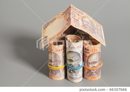 House Made Roll of Indian rupee banknotes isolated House Made Roll of Indian rupee banknotes isolated 66307666