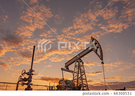 Petroleum concept. Oil pump rig. Oil and gas production. Oilfield site. Pump Jack are running. Drilling derricks for fossil fuels output and crude oil production. Global crisis. War on oil prices. Petroleum concept. Oil pump rig. Oil and gas production. Oilfield site. Pump Jack are running. Drilling derricks for fossil fuels output and crude oil production. Global crisis. War on oil prices. 66308531