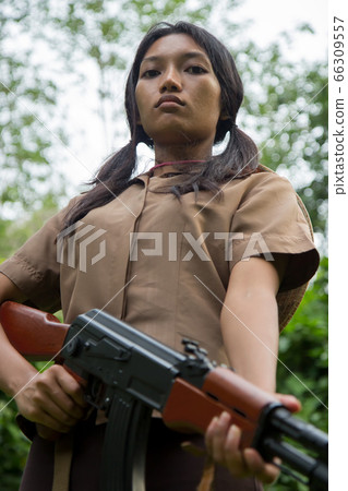 Asian woman armed 66309557