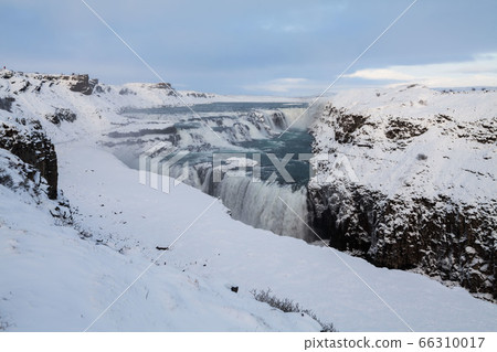 Gullfoss waterfall view in the canyon of the Hvita river during winter snow Iceland 66310017