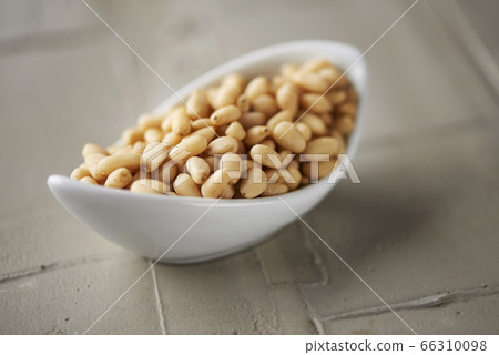 shelled pine nuts in a white bowl shelled pine nuts in a white bowl 66310098