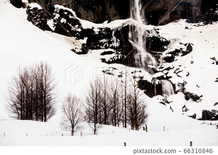Foss a Sidu waterfall view during winter snow in Kirkjubaejarklaustur, Iceland Foss a Sidu waterfall view during winter snow in Kirkjubaejarklaustur, Iceland 66310846