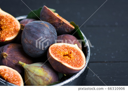 Fresh figs in a bowl on a table 66310906