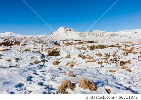Budakirkja or better known as The Black Church view with blue sky during winter snow, Iceland Budakirkja or better known as The Black Church view with blue sky during winter snow, Iceland 66311872