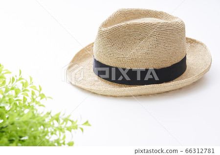 Straw hat placed on a white table Straw hat placed on a white table 66312781