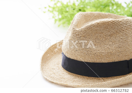 Straw hat placed on a white table Straw hat placed on a white table 66312782
