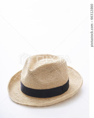 Straw hat placed on a white table 66312860