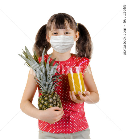 little girl hold pineapple and juice little girl hold pineapple and juice 66313669