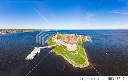 Europe. Russia, Leningrad region, St. Petersburg, Aerial panoramic view on fortress Oreshek near Schlesselburg town. Ancient Russian fort on island in Ladoga lake in sunny summery day Europe. Russia, Leningrad region, St. Petersburg, Aerial panoramic view on fortress Oreshek near Schlesselburg town. Ancient Russian fort on island in Ladoga lake in sunny summery day 66315242