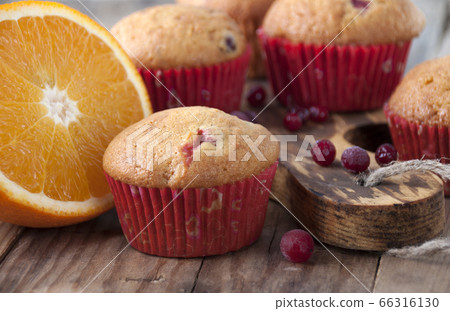 Orange muffins with cranberries 66316130
