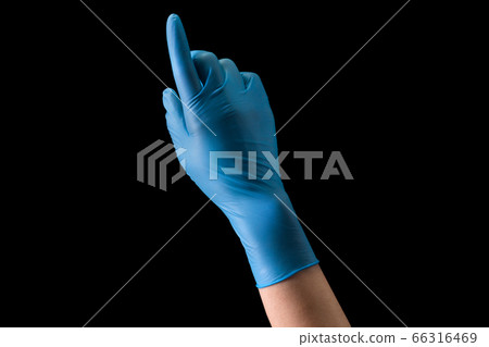 Doctor's hand in medical gloves touching screen by finger isolated on black Doctor's hand in medical gloves touching screen by finger isolated on black 66316469