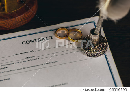 Man signing marriage contract, closeup 66316593