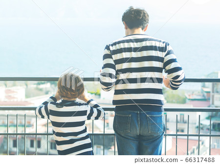 Father and son wearing striped shirts Father and son wearing striped shirts 66317488