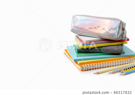 Colorful notepads and pencils on white table with copy space Colorful notepads and pencils on white table with copy space 66317832