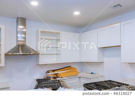 Installing new kitchen hood in modern installation 66318027
