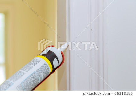Hands of worker using silicone tube for repairing 66318196