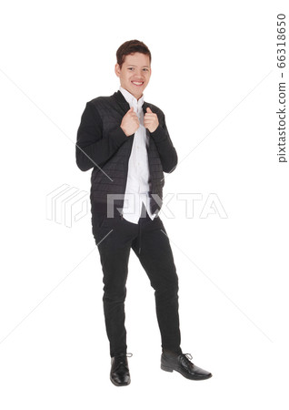 Smiling happy teenager boy standing in the studio Smiling happy teenager boy standing in the studio 66318650