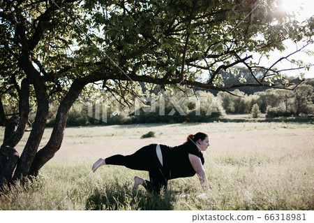 Overweight woman doing exercises on fitness mat Overweight woman doing exercises on fitness mat 66318981