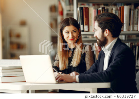 Two students study at the library Two students study at the library 66319727