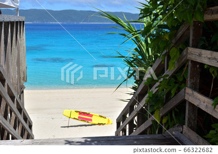 Emerald green sea seen from wooden terrace / Furuzamami beach 66322682