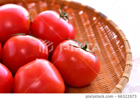 Ripe tomato in a colander Ripe tomato in a colander 66322873