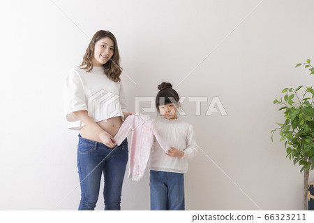 Pregnant woman and girl portrait Pregnant woman and girl portrait 66323211