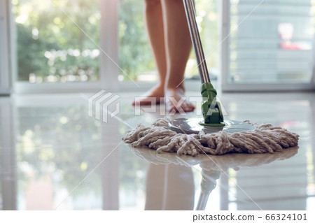 Asian women cleaning folk using mop tiles. Asian women cleaning folk using mop tiles. 66324101