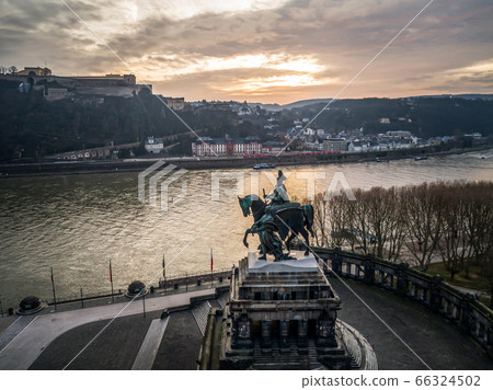 Colorful Sunrise burning sky Koblenz City historic monument German Corner where river rhine and mosele flow together 66324502