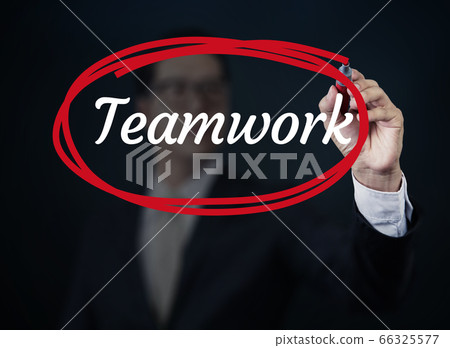 Businessman hand writing "Teamwork" with red Businessman hand writing "Teamwork" with red 66325577