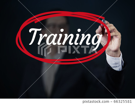 Businessman hand writing "Training" with red Businessman hand writing "Training" with red 66325581