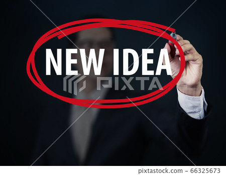 Businessman hand writing "NEW IDEA" with red 66325673