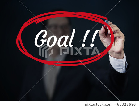 Businessman hand writing "Goal" with red marker on Businessman hand writing "Goal" with red marker on 66325686