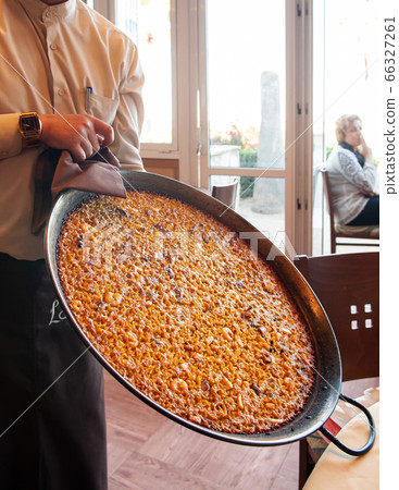 Hot Paella Spanish seafood fried rice in large pan. Valencia - Spain Hot Paella Spanish seafood fried rice in large pan. Valencia - Spain 66327261
