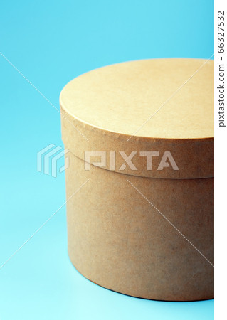 Round cardboard box on a blue background, free Round cardboard box on a blue background, free 66327532