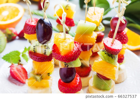Fresh fruit on skewers. Concept buffet for a Fresh fruit on skewers. Concept buffet for a 66327537