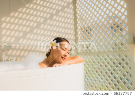 asian women happy smile relax with cocktails glass around outdoor swimming pool in hotel resort asian women happy smile relax with cocktails glass around outdoor swimming pool in hotel resort 66327797