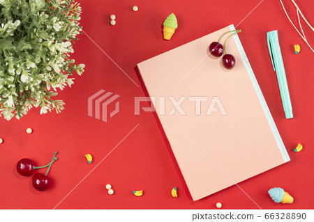 flat lay stationery on work desk in red pastel background 66328890