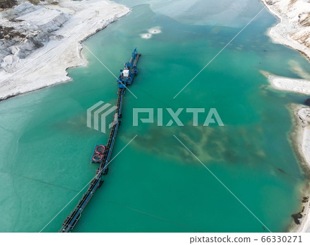 Aerial view of the long boom of a suction excavator Aerial view of the long boom of a suction excavator 66330271