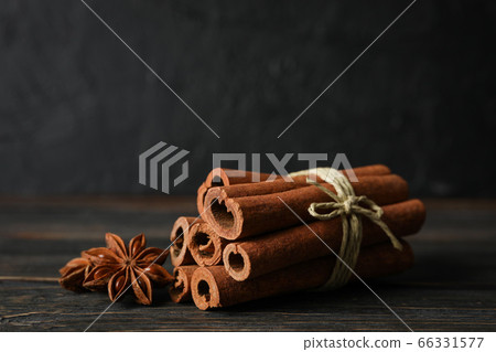 Cinnamon sticks and anise stars on wooden 66331577