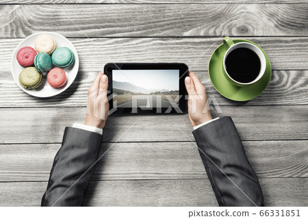 Businesswoman having coffee break 66331851