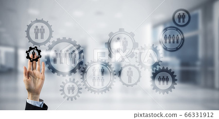 Teamwork concept and choosing gesture of businessperson in elegant modern interior Teamwork concept and choosing gesture of businessperson in elegant modern interior 66331912