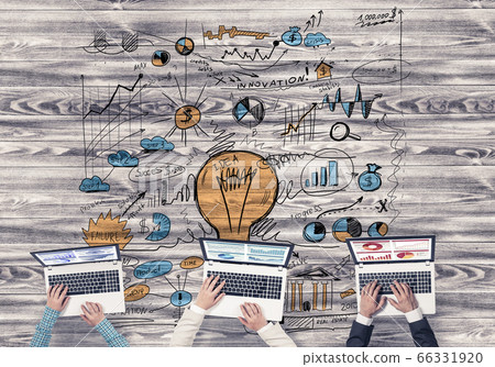 Top view of businesspeople sitting at table and using gadgets Top view of businesspeople sitting at table and using gadgets 66331920