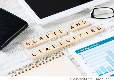 Assets and liabilities concept with letters on cubes 66332658